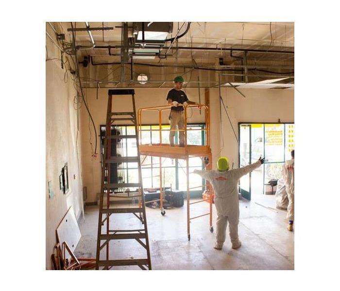 Technician on scaffold.