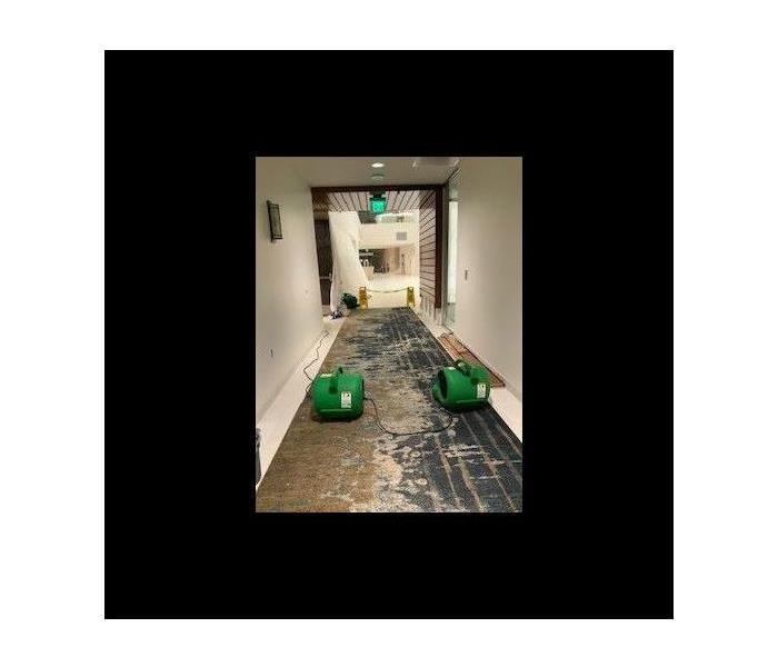 Air movement devices in a hallway.