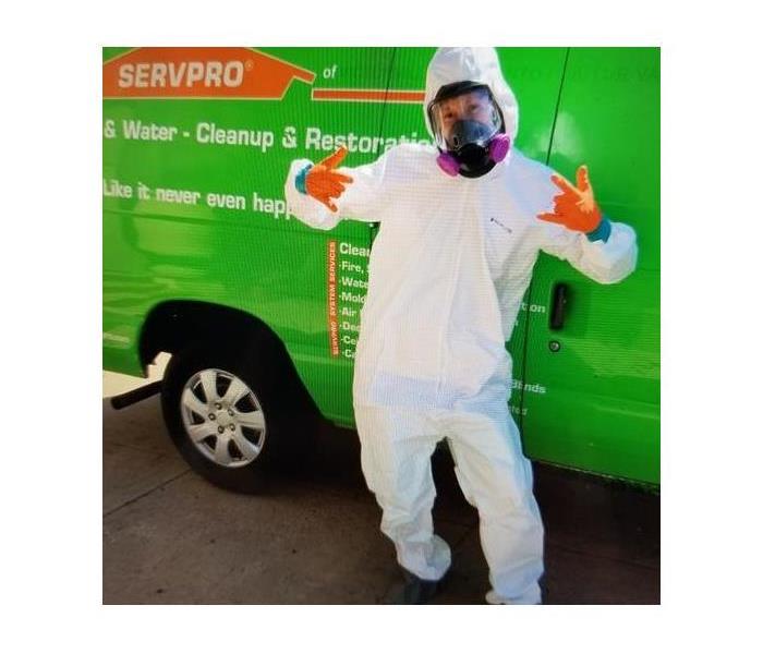 Happy employee in front of van.